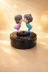 Acto Solar Powered Rotating Kissing KS01 Couple Showpiece with Aroma Diffuser Bottle – Romantic Dashboard & Home Decor