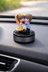 Acto Solar Powered Rotating Kissing KS03 Couple Showpiece with Aroma Diffuser Bottle – Romantic Dashboard & Home Decor